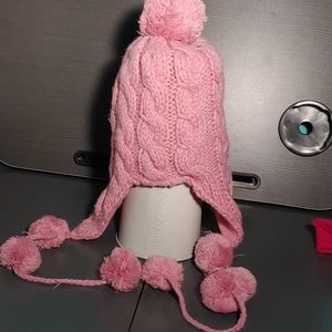 Winter pink knitted beanie with puff balls